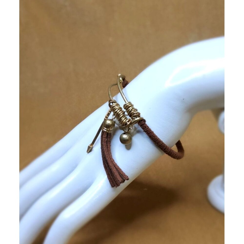 vintage gold tone leather wrapped meta larrow and tassel hook closure bracelet
